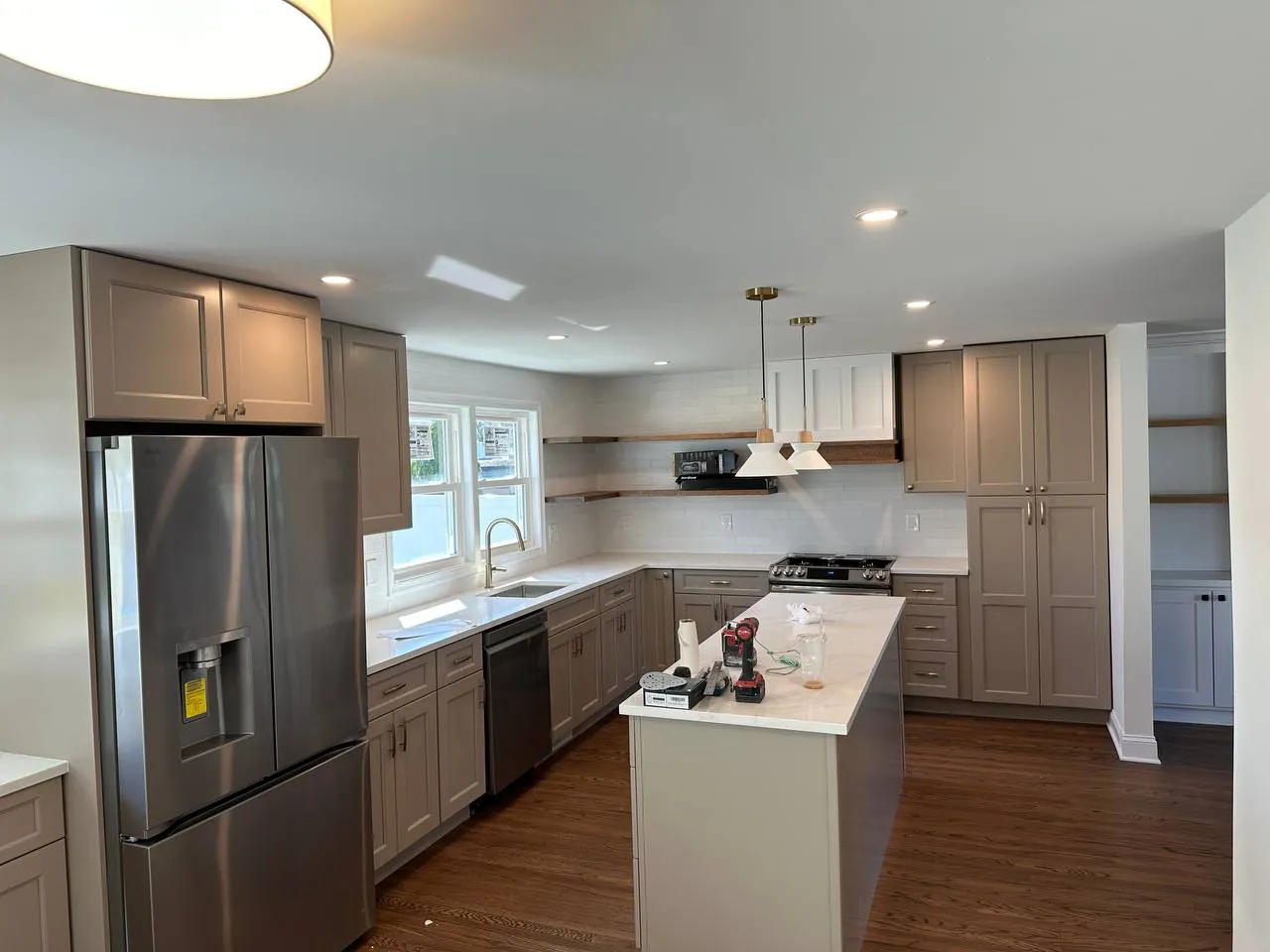 Kitchen with recessed lighting and pendants