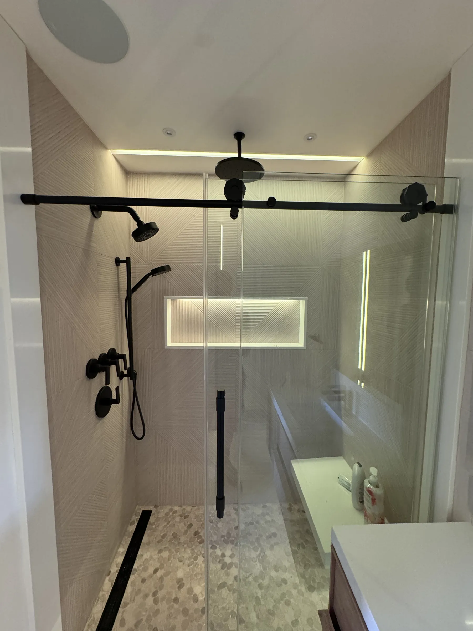 Bathroom with LED niche and ceiling lighting