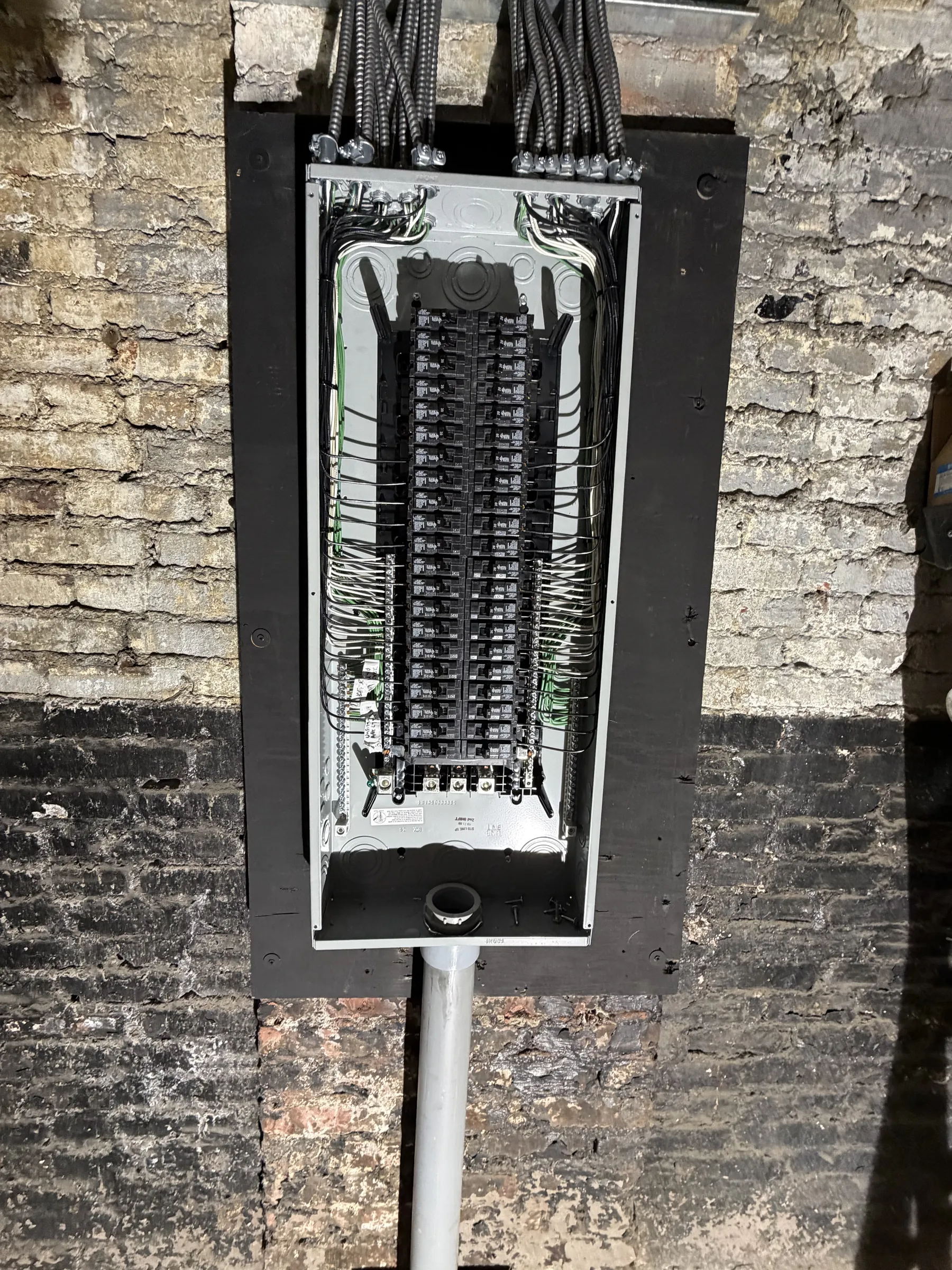 Panel replacement on a brick wall