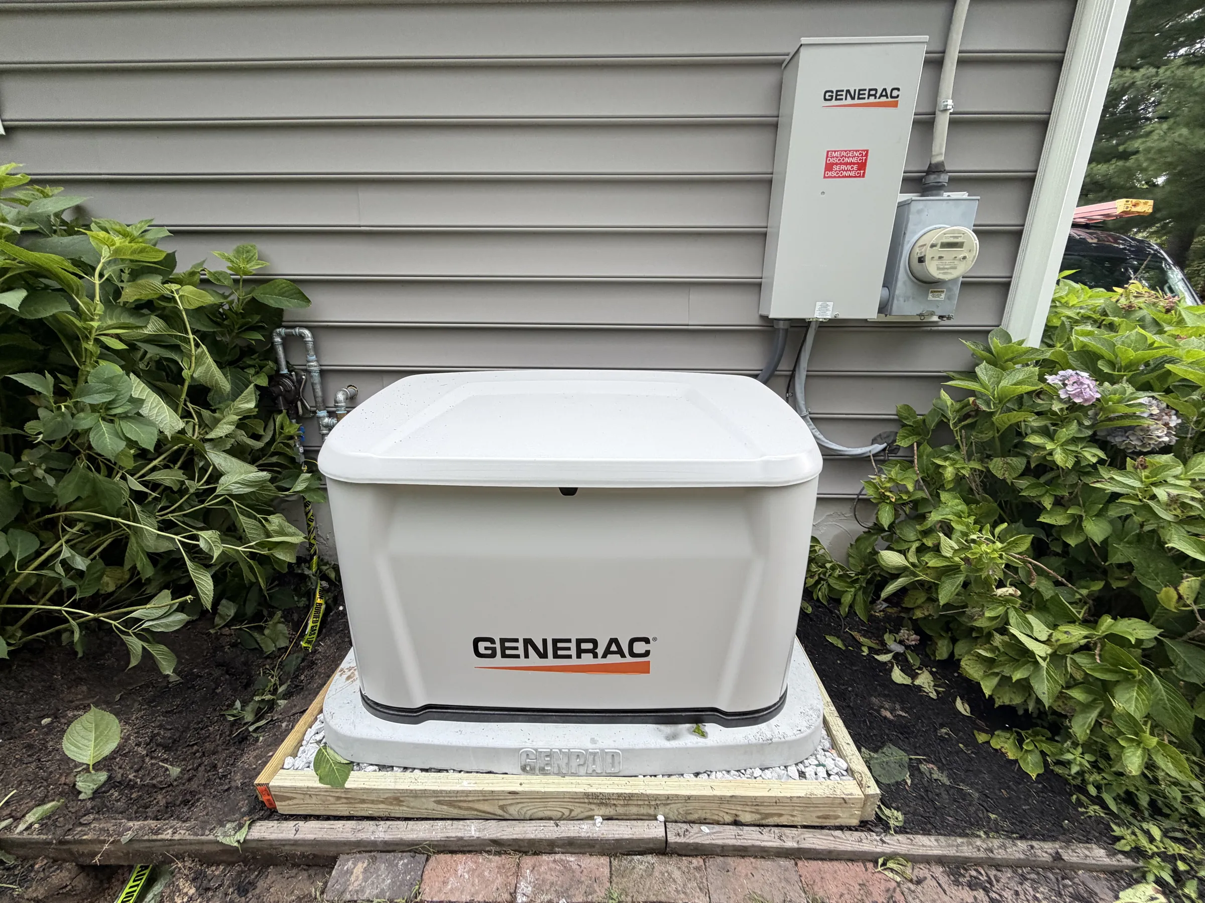 Generac generator next to a home